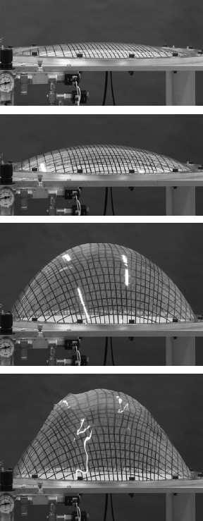 The burst test was performed with samples of ETFE foil and were clamped in a bubble inflation test device between an aluminium plate and an aluminium ring.