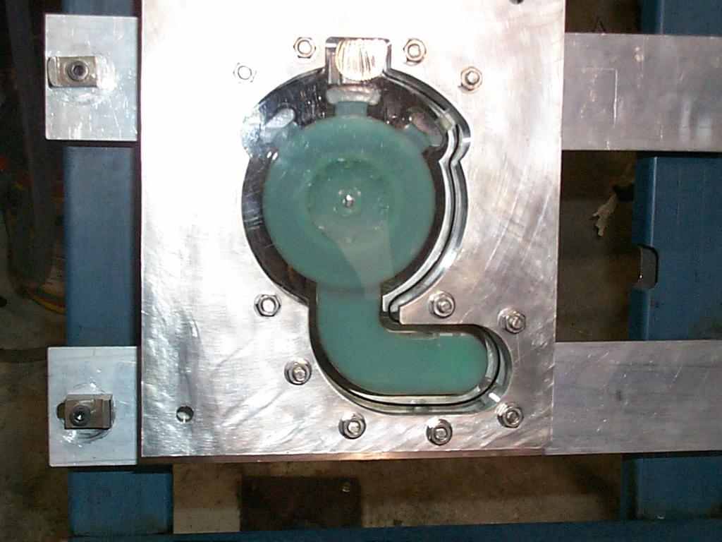 The filling process is captured by a high speed video camera, operating at a shutter speed of 1/20000 second. Figure 4 shows the view of the die as seen by the camera.