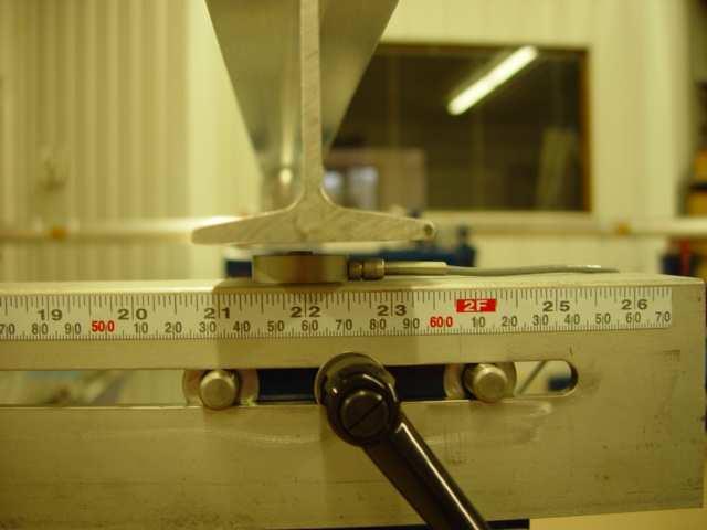 Hit calculate to give you the strain values. Save your results. Position load cell under center of I-beam Step 5. Measure the beam cross section and determine its Area Moment of Inertia.