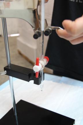 You can adjust the burette at any time by raising and lowering it within the spring arm clamps of the Double Burette Clamp.