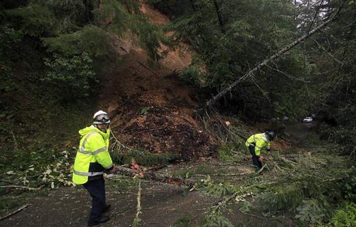 highway crumbles as storm-soaked hillside