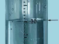 The funnel directs the precipitation into the measuring tube and magnifies it by a factor of 10. This allows observers to report rainfall to the nearest 0.01 (one hundredth of an inch).