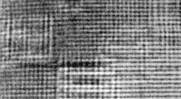 MOIRÉ FRINGES HRTEM image of a Kr nanocluster on a Mg substrate showing Moiré
