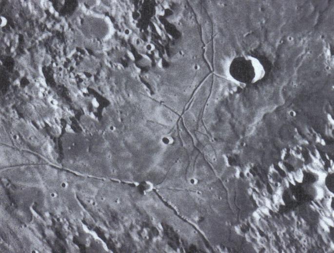 Some of the larger craters may have terraced walls both inside and outside the main rim.