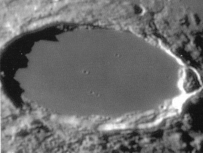 was thrown out on impact when these craters were created. In the images above is a feature called the Straight Wall.