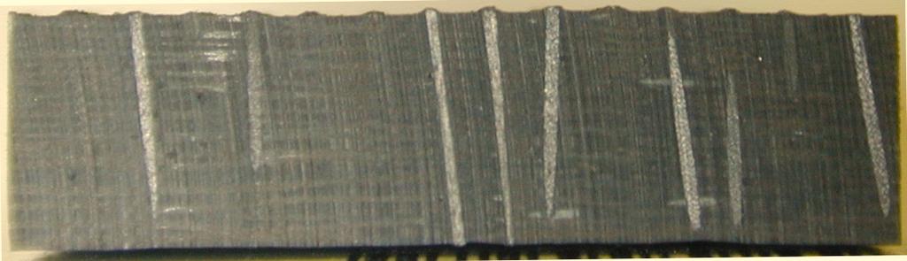 Ultrasonic hammer. Z-fiber. Foam preform. Laminate. a b c Figure 1. (a) Z-fibers held in foam preform positioned on laminate. (b) Ultrasonic hammer drives Z-fibers into laminate.