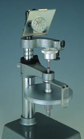 The stancion is vertically adjustable according to the type of gauges and reading is done while looking at the scale plate and the cursor line.