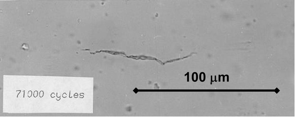 Figure 1: Impression of surface fatigue crack in a high-strength steel. The specimen failed after the application of about 100 000 cycles.