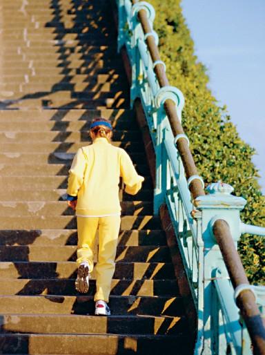 Example: Stair-climbing power. A 60-kg jogger runs up a long flight of stairs in 4.0 s. The vertical height of the stairs is 4.5 m.