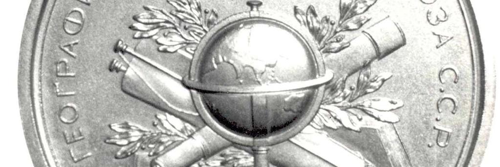 globe (showing the Middle East, Asia and Australia), atop a book, with a compass to
