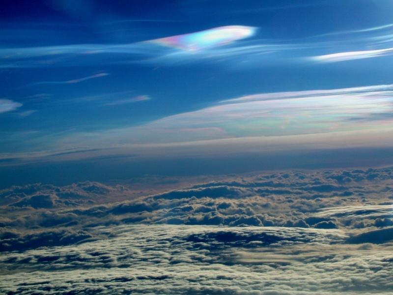 Polar Stratospheric Cloud, seen from the NASA DC-8 on 14 January 2003 (photograph by Paul Newman, GSFC). These are naturally occurring clouds composed of small nitric acid and water particles.