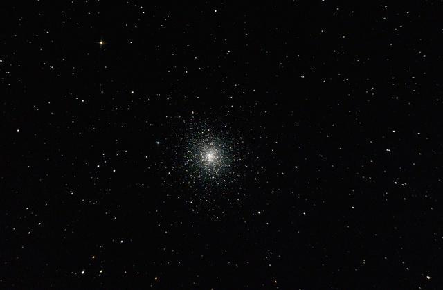 Using a telescope a beautiful ball of stars can be seen, this is an object called a Globular Cluster.