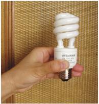 Compact fluorescent lamps (CFLs) are a type of fluorescent lamp that fits into a standard lightbulb socket. For the same wattage, CFLs emit much more light and much less heat than incandescent bulbs.
