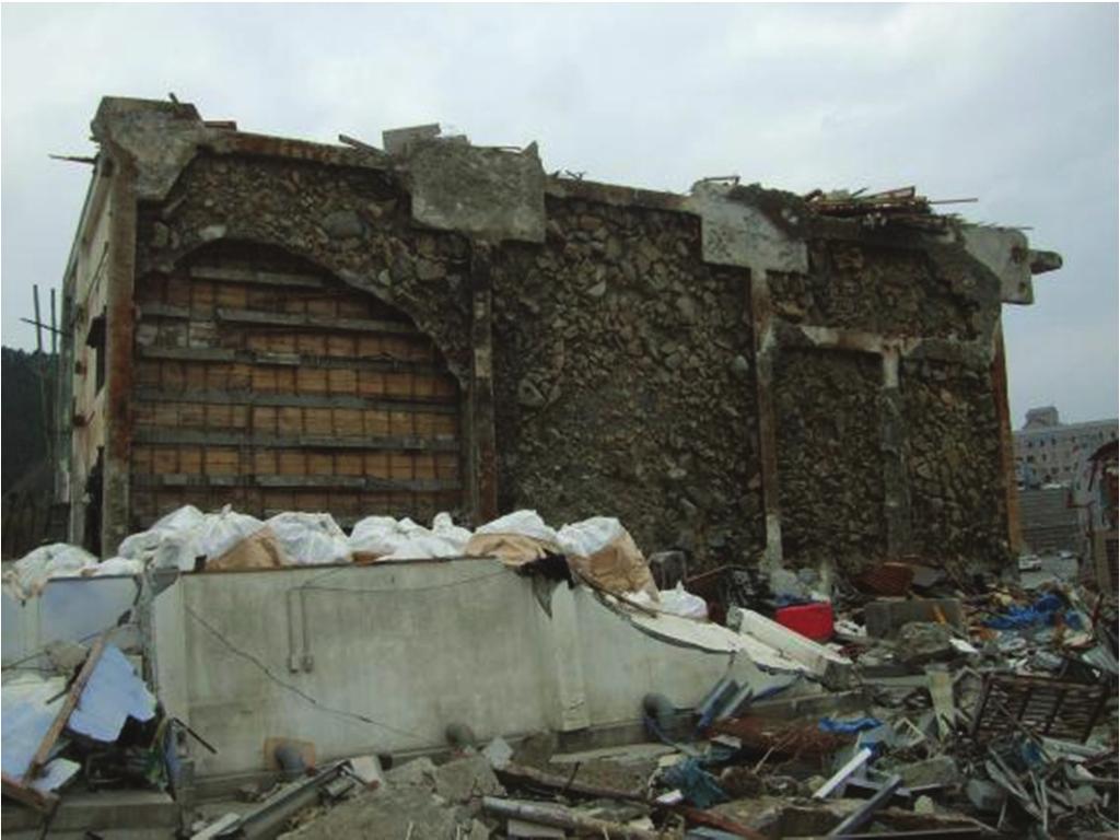 Fig. 9 Building #4: toppled west from its original Location at N38.440608, E141.446511. This was a steel-frame cold storage warehouse for fishes and seafood products.