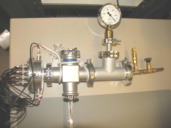 Chapter The T piece at the top of the sample stick, allows the connection to the temperature controller, and to the switching box, as well as contains a pressure gauge, a pressure relieve valve and