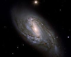 Galaxies M66 and M65 in Leo Messier 66 (also known as NGC 3627) is a barred spiral galaxy about 36 million