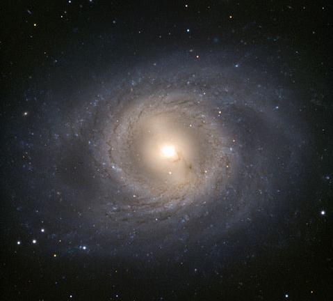 M66 showing the Spiral Arms at the end of a bar Messier 65 (also known as NGC 3623) is a spiral galaxy about
