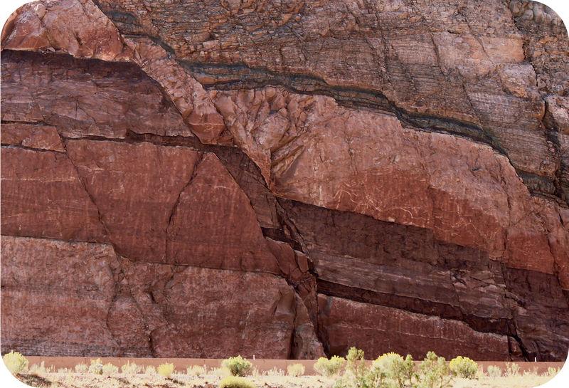 The energy released is an earthquake. FIGURE 6.11 Faults are easy to recognize as they cut across bedded rocks. How do you know there s a fault in this rock?