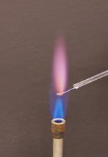 White precipitate soluble Spectroscopy (a type of flame test) is used to