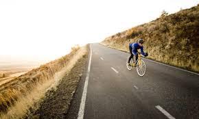 Example problem: Power A bicyclist coasts down a 7.0 o hill at a steady speed of 5.0 m/s.