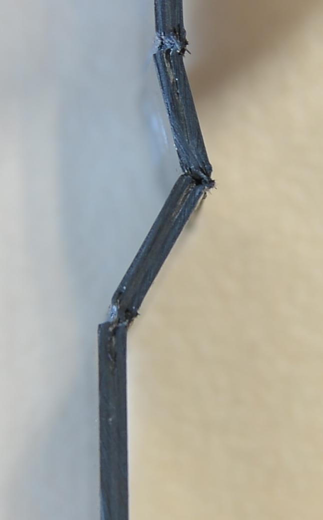 In phase one, after initiation of contact between work piece and punch and exceedance of the material strength of the matrix, a crack is propagating through the matrix material.
