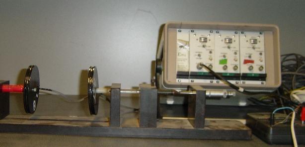 Figure 5.7. Emu strain coil calibration set up. Static Volts 6. 5. 4. 3. y = 643577x -2.5115 2. R 2 =.9995 1.. 5 1 15 2 Static Coil Distance (mm) Dynamic Volts for 2 turns or 1.27mm 6. 5. 4. 3. y = 9E+6x -3.