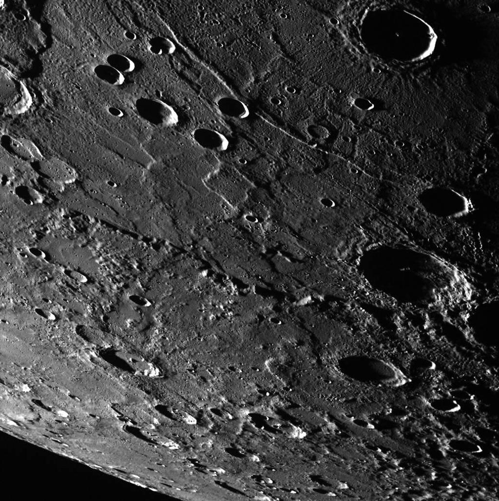 surface resembles that of Earth's Moon Scarred by many impact craters resulting from collisions with meteoroids and comets Has