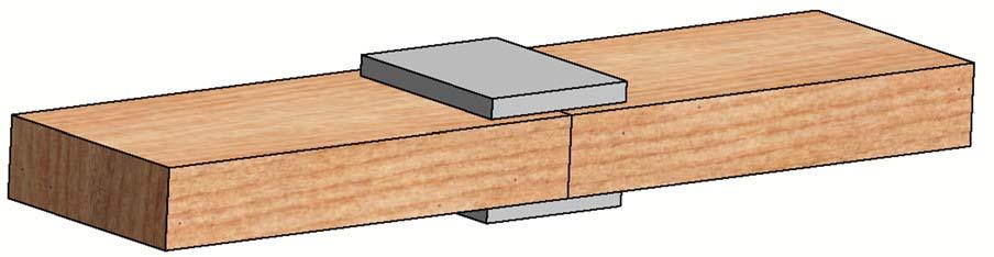 Two 2 x 6 boards are glued to one another and to two 4 x 5 x ½ splice plates, as shown.