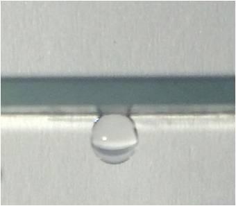 Figure S2 Photo of a 15 μl water droplet suspended on the upside down surface of a patterned graphene film.