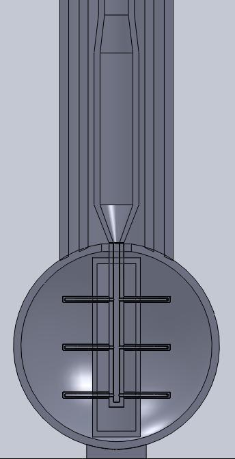 reactor is made of fused silica with a nozzle assembly for the entry