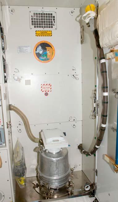 For solid waste, astronauts must use foot straps and handles to stay in place. They have to position themselves over a 4-inch (10 cm) opening.