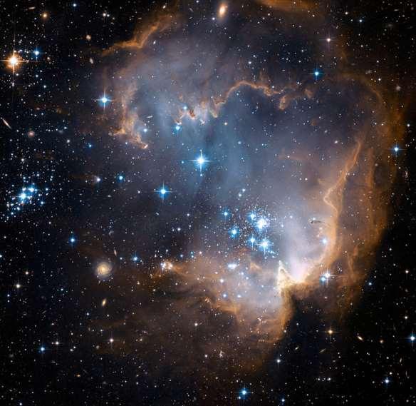 NGC 602 is the designation for a particular young, bright open cluster of stars located in the Small Magellanic Cloud, a satellite galaxy to our own Milky Way.