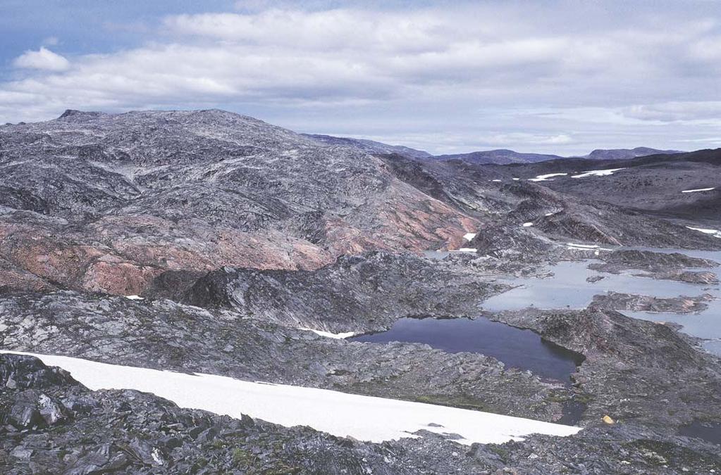 Fig. 15. The basal part of the Ketilidian supracrustal succession in central Grænseland, South-West Greenland, with the Archaean basement in the left background, viewed towards west-north-west.