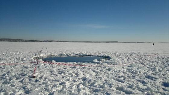 Hole in ice, Chebarkul lake 70 km W of Chelyabinsk