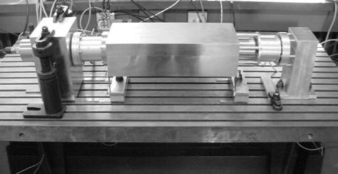passive suspension frequency of 2.7 Hz. On the left hand side of this payload, the reference mass housing is horizontally mounted on a second aluminium block that is clamped to the table.