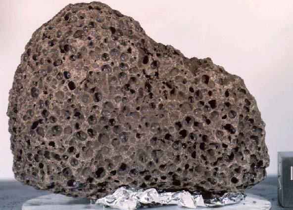 15016 Vesicular Olivine-normative Basalt 923.7 grams Figure 1: Photograph of vesicular basalt 15016. NASA# S71-46632. Cube is 1 inch.