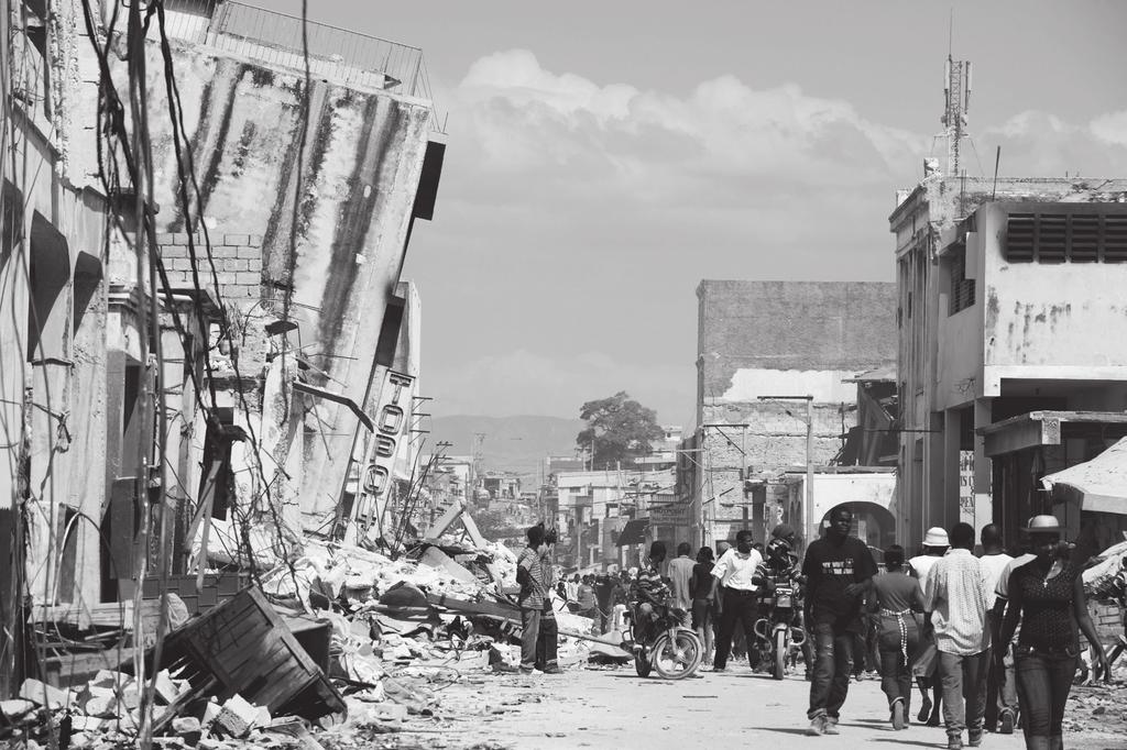 (c) The photograph shows part of the damage caused by an earthquake in Haiti.