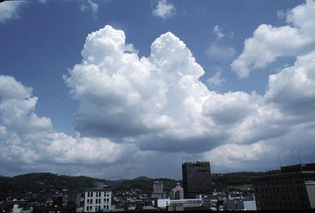 Cumulus These clouds have a flat base and a dense, moundshaped top that resembles a large cauliflower.