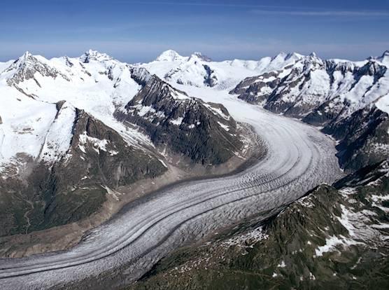 Glaciers Glaciers are large ice fields that slowly flow downhill over time.
