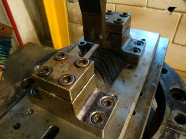 Figure 18. Beam specimen ready for test in Drop Hammer. A laser Doppler velocimeter was used and positioned at a certain height above the specimen, as shown in Figure 19.