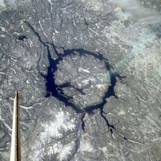 Manicouagan Crater, Quebec Canada 100 km, 212 million years note tail of space shuttle Columbia, 1983. Lake is 70 km in diameter.
