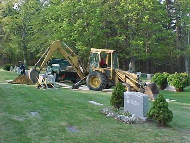 The backhoe is brought in across plywood so it does not create ruts on any of the