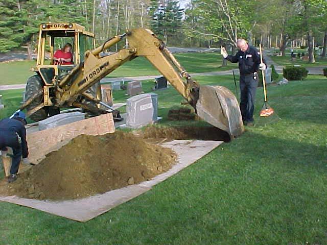 between monuments. This requires a great deal of skill by the backhoe operator. The staff acts as spotters for the backhoe.