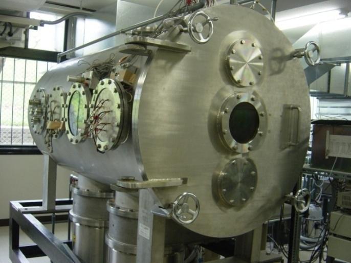 The experimental facility is shown in Figure 6. The thruster is operated in a water-cooled stainless steel vacuum chamber with 1.2 m in diameter and 2.25 m in length.