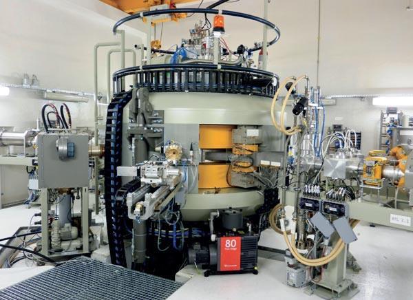 Cyclotron In a cyclotron, a magnetic field is used to deflect charged particles into a circular path and an electric field is used to accelerate the charged particles between a pair of electrodes.