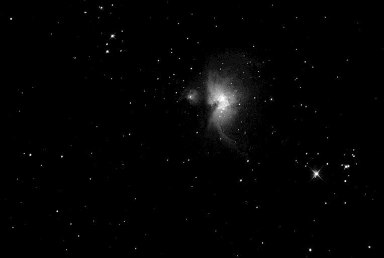 Binocular view of M42 with Orion s belt at the top A small to medium sized telescope will show a larger view and some detail in M42.