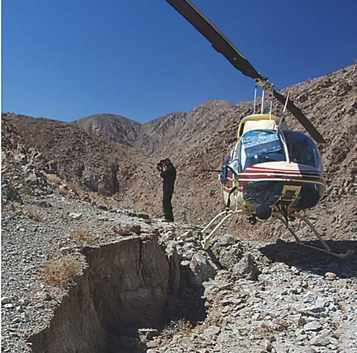Ken Hudnut takes photos of the fault scarp in Baja California in Aug. 2010 following the El Mayor - Cucapah earthquake courtesy of Prof. John Fletcher, CICESE.