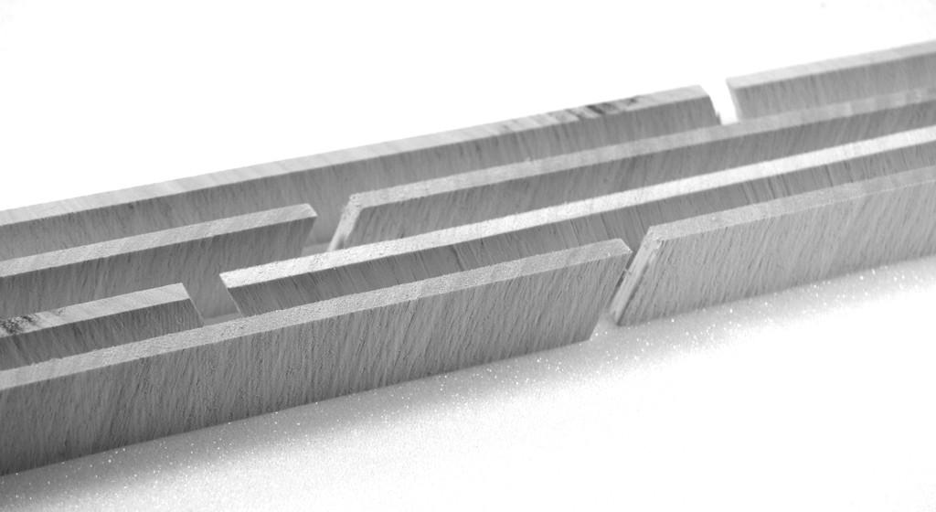 Subsequent cuts are separated a distance H c corresponding to the desired core material thickness.