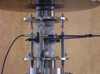 Experimental characterization of the compressive behaviour of granites stiff frame connected with an appropriate closed-loop control system at the Structural Laboratory of University of Minho.
