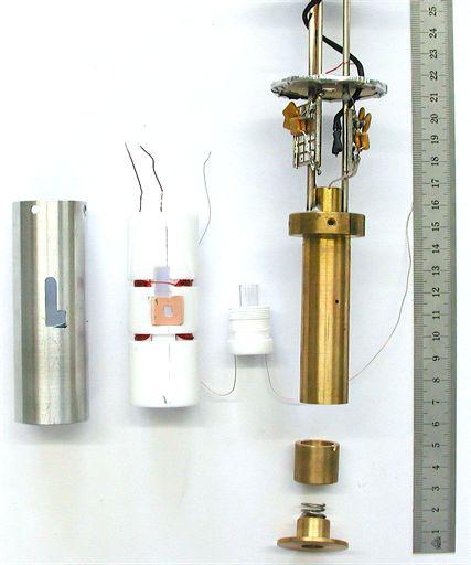 The cryostat insert 1: ESR dielectric ring resonator with TE 011 brass cavity sample size: 14 mm height, 7 mm inner diameter (<